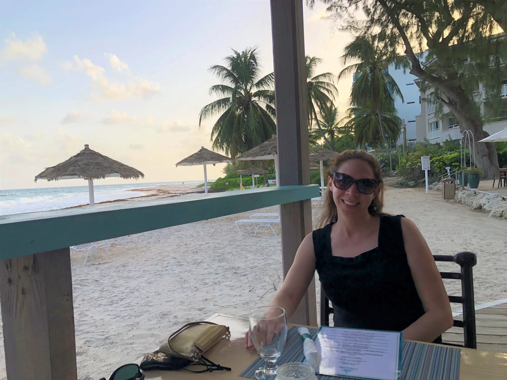 Monica having dinner by the beach.